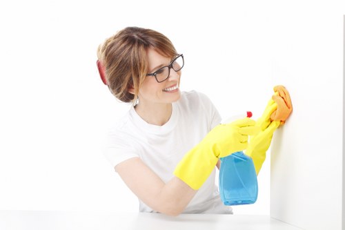 Technician using hot water extraction for carpet cleaning